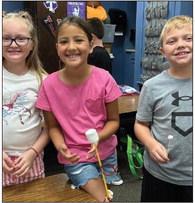 Third-graders Aubree Richard, left, Sophia Manuel, Quade Weatherly.