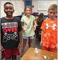 Third-graders Braylen Coffee, left, Peyton Roberson, Maverick Orr.