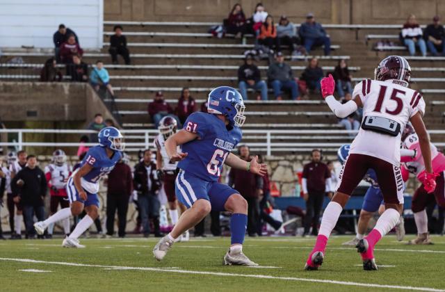 Bobcat Kade Jenkins (61) holds off a Tulia Hornet Friday, Oct. 13.