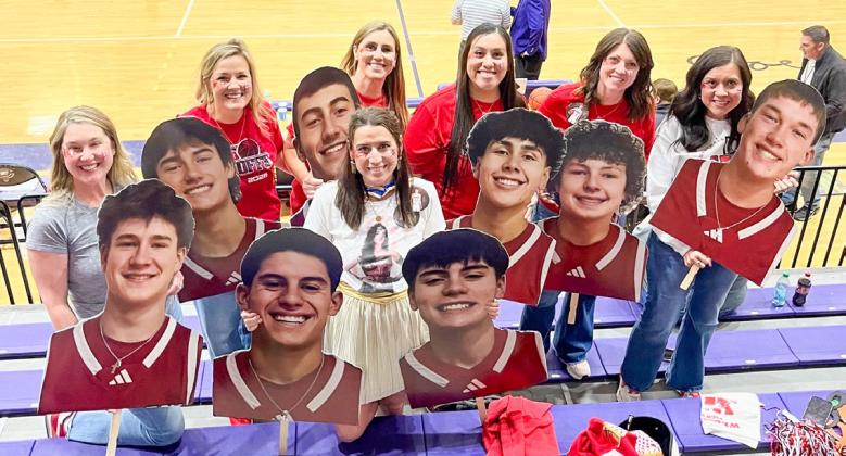 With a “superhero” theme, Skyrocket moms display cutouts of basketball players prior to the UIL 2A Division 1 Regional Final Championship Friday evening, March 6 at Canyon High School. From left: Amanda Kane, Amy Inman, Christy Kane, Ashly Cantu, Denise Garcia, Megan Wischkaemper, Sandy Killian. Courtesy Photo