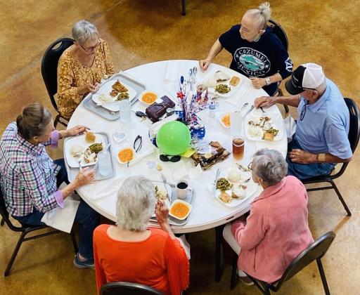 While chicken fried steak, mashed potatoes, green beans, roll and apricots comprised the Wednesday, June 11 birthday celebration menu, friends gather for lunch from 11:30 a.m.-12:30 p.m. at the Wellington Senior Citizens Center. Clockwise, from left: Sharon Starkey, Pat Barnett, Charlotte and Tony Stephens, Fran Eigenmann, Vada Wood.
