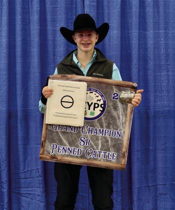 Sterling Bruce exhibits the Grand Champion Senior Penned Cattle, purchased by First United Bank.