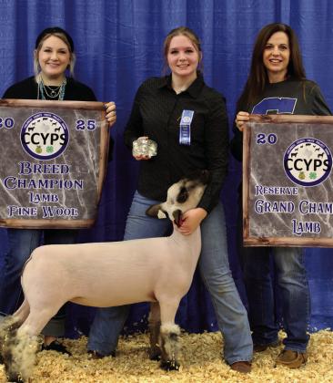 Kodi Teague exhibits the Reserve Grand Champion Lamb, as well as the Fine Wool Lamb Breed Champion, purchased by Vest Ranch.