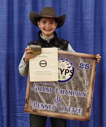 Quay Bruce exhibits the Reserve Grand Champion Junior Penned Cattle, purchased by Lott’s Ace Hardware.
