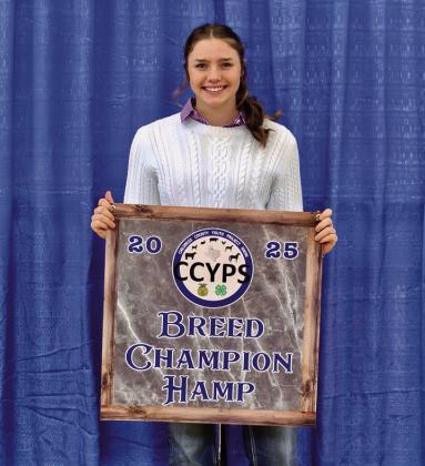 Colee Cox exhibits the Hampshire Breed Champion, purchased by Cherry Electric.