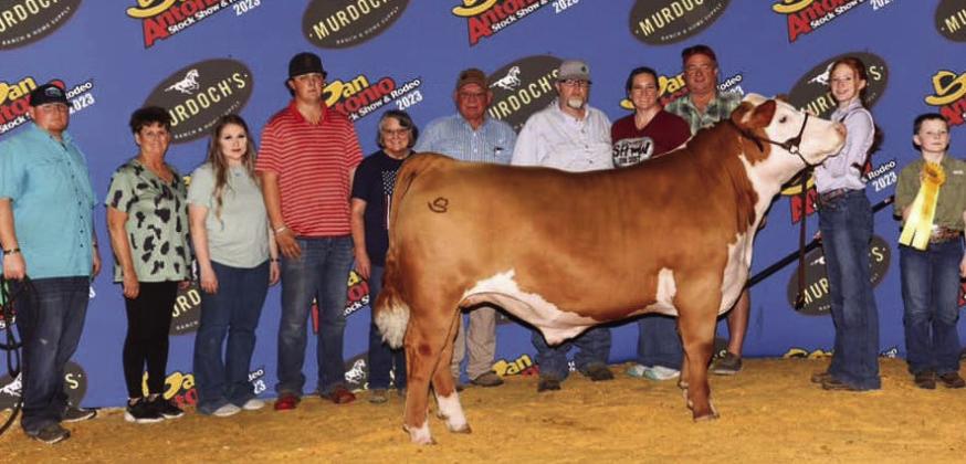Bailey Page, an eighth grader at Wellington Junior High School, earns fifth place with her heavy weight Hereford “Astro” at the San Antonio Stock Show and Rodeo. From left: Trevor Rosso, Manda Gaskins, Hannah Worlein, Connor Cross, Teresa Gaskins, Kelly Gaskins, Jeremy Page, Katie Page, Van Gaskins, Bailey Page, Jacob Page. Courtesy Photo