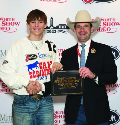 Childress County 4-H member Drake Rabe wins a $500 purchase certificate toward a beef or dairy heifer for exhibition at next year’s Forth Worth Stock Show and Rodeo. The certificate, presented by Stock Show Calf Scramble Committee Chairman Paxton Motheral, was sponsored by Frost. Photo Courtesy of Fort Worth Stock Show and Rodeo
