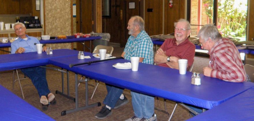 Joe Robinson, left, recounts his United States Navy days at the recent Adult Fellowship Luncheon at Childress Methodist Church. Robison’s talk, animated with hand gestures and facial expressions, with bits of audible laughter and abundant smiles, evoked laughter from listeners, as shown by, from left, Harvey Dobbs, Joe Steele and Kevin Crain. Also in attendance were Childress Methodist Church Pastor Lou Ellerbrook, Anne Fromm, Grace Holman, Lila Hoobler and Ann Simmers. GRACE HOLMAN