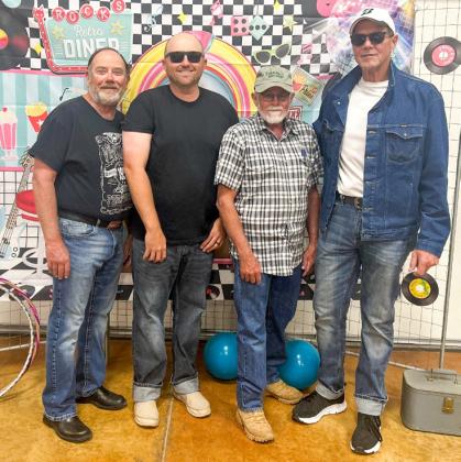 A rendition of the local band Atteberry Station, musicians and vocalists Dickie Johnson, left, Justin Mixon, Ed Campbell and Paul Dockter perform live music for the recent Wellington Senior Citizens Center 1950s social in the historic auditorium of the Bura Handley Community Center.