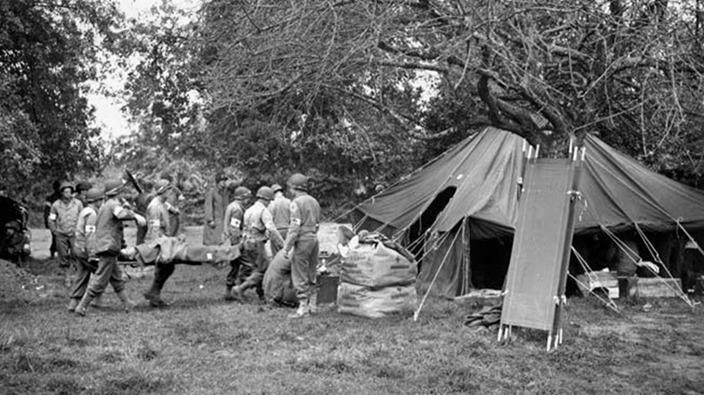 Wounded soldier carried to an aid station