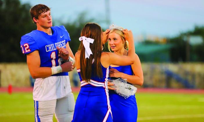 Childress senior Kate Taylor, accompanied by escort Seth Taylor, is crowned the 2022 Childress High School Homecoming Queen during halftime at the Childress vs. Breckenridge game Friday, Sept. 2 at Fair Park Stadium. Photos by Childress High School Yearbook Staff