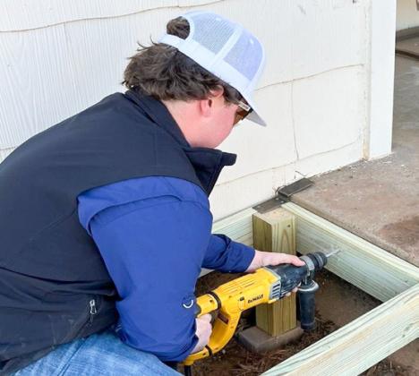 A Rocket Leo Club recruit, Wellington High School junior Hunter Hedrick volunteers his time on Saturday, Feb. 7, assisting with building ramps in Wellington.