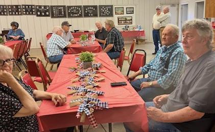Ramona and Tommy Hightower, of Dodson, and Grady Cochran, of Wellington, spend time catching up at the recent Dodson Ex-Students Reunion.