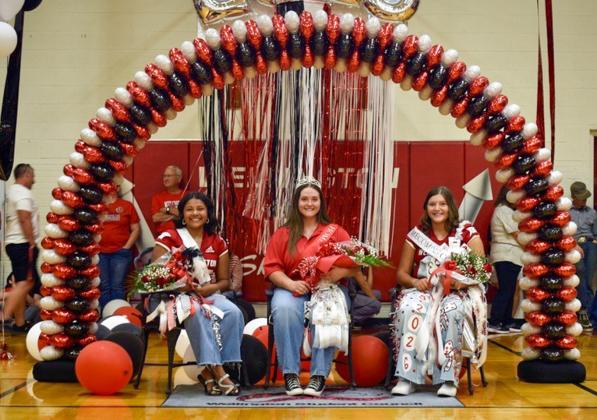 Rocket Regiment senior Bailey Steagall, center, accepts the honor of Band Queen during the Sept. 13 homecoming pep rally festivities in the Wellington High School gymnasium. First runner-up Jasmin Moreno, left; and second runner-up Eryn Torrez, right, complete the Rocket Regiment Homecoming Court. Junior Rocket Regiment boys served as escorts for the royalty. Back row, from left: Jacob Lee, Sawyer Smith, Christopher Reyes, Alladin Rodriguez, Kris Valdez. Wellington High School