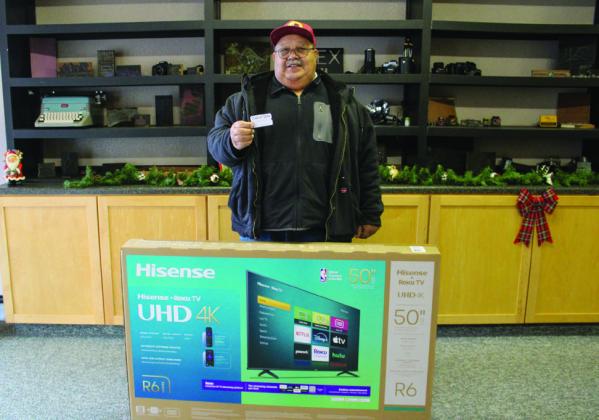 Jorge Lepe claims the 50” television drawing prize during the Treasure Hunt, sponsored by The Red River Sun and Childress Downtown Historical Association, Friday, Nov. 29.