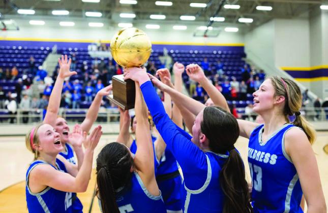 The Childress Lady Cats celebrate a bi-district win over Canadian Monday, Feb. 14. Joe Garcia III/Press Pass Sports