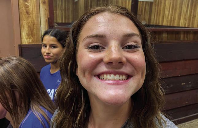 Courtesy Photos The varsity Childress Lady Cat volleyball team enjoys a surprise team dinner, including games and chow, last week at the Fair Park City Auditorium.