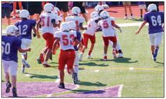 The Red River Sun/Shauna Salinas Seventh grade Firecrackers Jax Heflin (7) and Alex Orozco (5) take down a River Road Wildcat in the 20-0 win with Dakota Ledbetter (53), Tristan Hardaway (51), Kayden Granadoz (64) and others assisting in the stop of the ball.