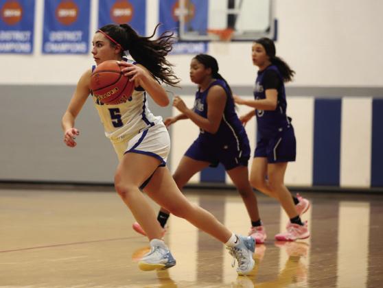 Childress’ Aspen Lomax drives the ball forward during the Lady Cats’ matchup against the City View Lady Mustangs during the Childress Rotary Holiday Invitational Thursday, Dec. 8.