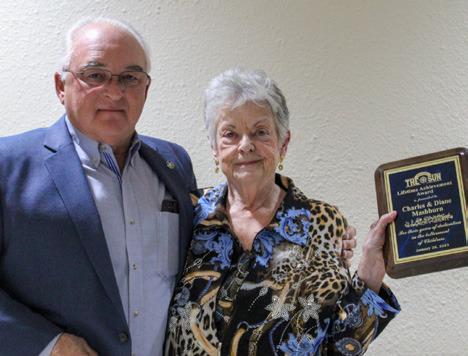Diane Mashburn accepts the Lifetime Achievement Award, given to her and her husband, Charles “Charlie” Mashburn, from Larry Johnson during the Childress Chamber of Commerce Awards Banquet in January. The Red River Sun/Elizabeth Tanner