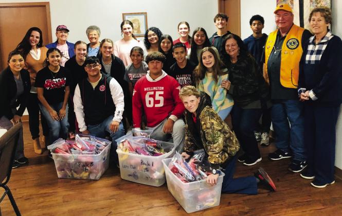 Students assist Wellington Lions Club with senior snack packs