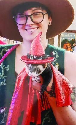Clover, with her furry ferret friend, takes the adult female category first-place prize of $50.