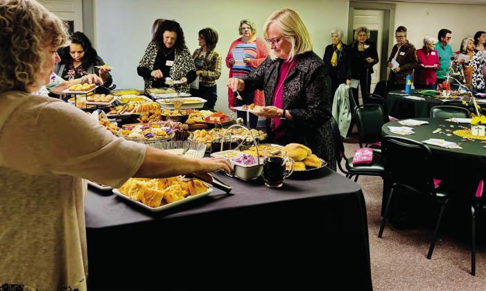 Prior to Debbie Hanna Skinner’s inspirational presentation in the sanctuary of the church, she and guests dine on the brunch fare in the Fellowship Hall. Tammy Rodriguez left, puts the finishing touches on the serving table as Skinner leads the women through the line. “Our desire is to feed our physical bodies with delicious foods and feed our spirits with a poignant word,” Pastor Leah Fort said. Photos courtesy of Wellington Nazarene Church