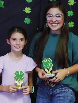 Peyton Roberson, left, earns the Junior Silver Accomplishment Award, while Brylnn Kemp garners the Intermediate Silver Accomplishment Award.
