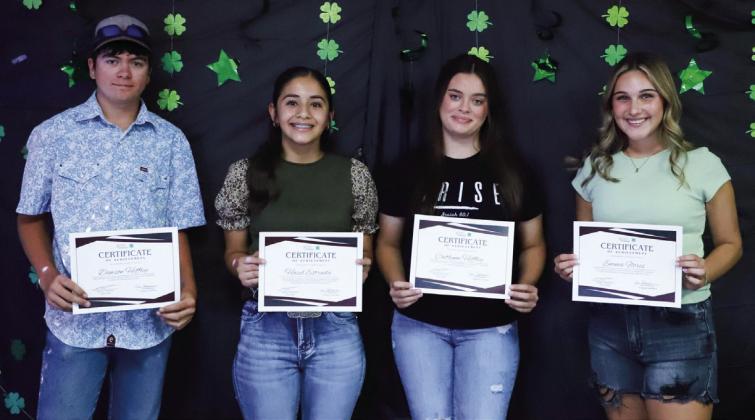 Senior and Intermediate Division 4-Hers Dawson Heffley, left, Hazel Estrada, Caitlynn Heffley and Emma Flores receive Certificates of Achievement for completing 4-H project forms. Not pictured: Bella Padilla, Wade Patterson, Aison Skelton, Kenady Skelton.