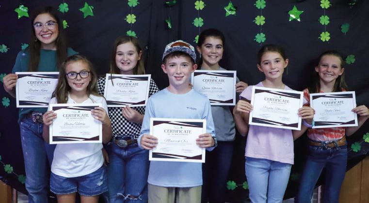 Intermediate and Junior Division 4-Hers Brylnn Kemp, left, Briley Holton, Presley Kemp, Maverick Orr, Quinn Roberson, Peyton Roberson and Raylie Sims display Certificates of Achievement for completing 4-H project forms. Not pictured: Hadlee Patterson.