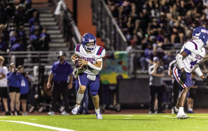 Bobcat quarterback Drake Rabe (15) looks for an open receiver during Childress’ 41-25 fall to the City View Mustangs Friday, Sept. 27.