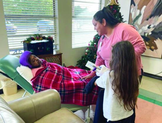 Austin Elementary School, Memphis Middle School students  bring Christmas cheer to Memphis Convalescent Center