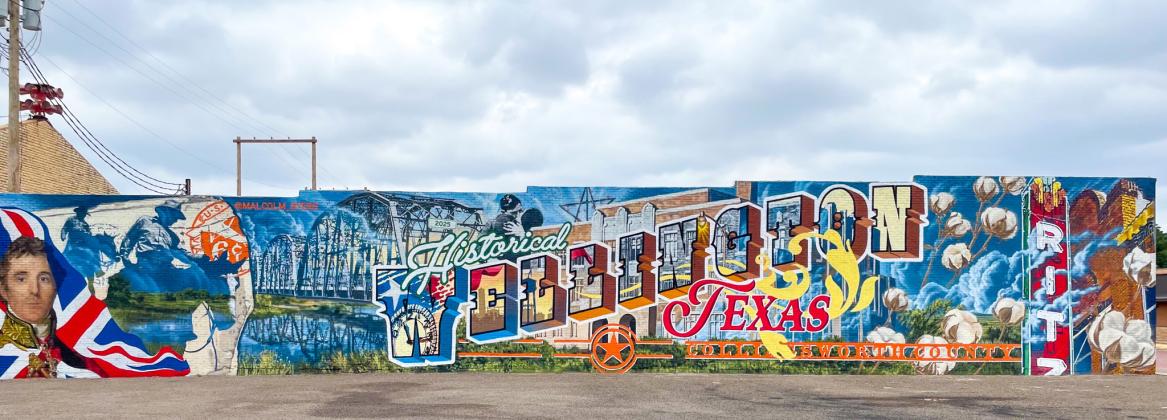 Commissioned by the Wellington Community Fund, depicting Collingsworth County and Wellington history, muralist Malcolm Byers presents his final mural design, finishing the last spray paint stroke around 12:30 p.m. Friday, Sept. 5 at 915 West Ave. Bryer said he appreciates Wes Reeves’ “expert Texas county history, knowledge and Wellington roots.” Muralist Malcolm Byers