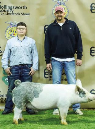 Aison Skelton shows his third-place class 4 cross swine with buyer Farmers Co-Op, represented by Jason Wischkaemper.