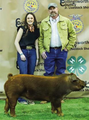 Kenady Skelton exhibits her third-place dark other purebred (OPB) swine with buyer Cattlemens Bank, represented by Robert Horton.