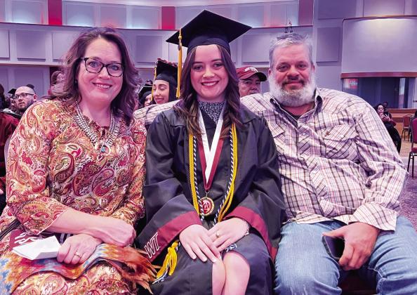 Maryann Heffley, center, accepts congratulations from her parents, Cynthia and Jason Heffley, at the West Texas A&amp;amp;M University Donning of the Stoles ceremony.