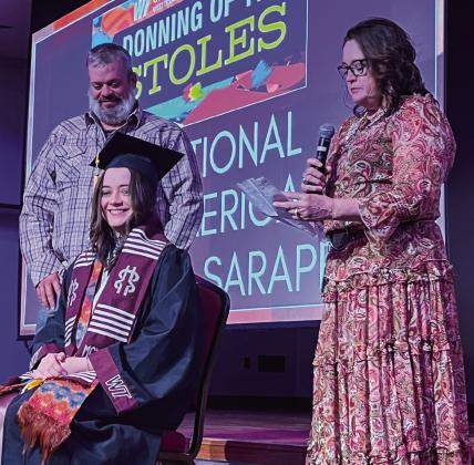 Maryann Heffley’s parents, Jason and Cynthia Heffley, of Wellington, participate with her in the West Texas A&amp;amp;M University Donning of the Stoles ceremony on Friday, Dec. 9. Courtesy Photos