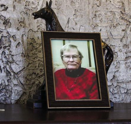 Photos of the late Orvilla Evans are scattered throughout the Memphis Housing Authority lobby during a memorial bench dedication service Thursday, Feb. 27. The Red River Sun/Elizabeth Tanner