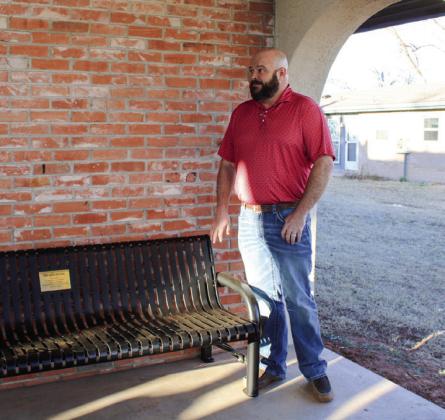 Memphis Housing Authority Executive Director Josh Talley unveils a bench, honoring the late Orvilla Evans, who served a 20-year tenure on the Memphis Housing Board of Commissioners, Thursday, Feb. 27.