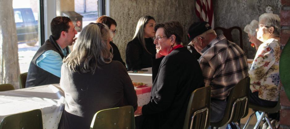 Guests gather following a memorial bench dedication service honoring the late Orvilla Evans Thursday, Feb. 27 at the Memphis Housing Authority.