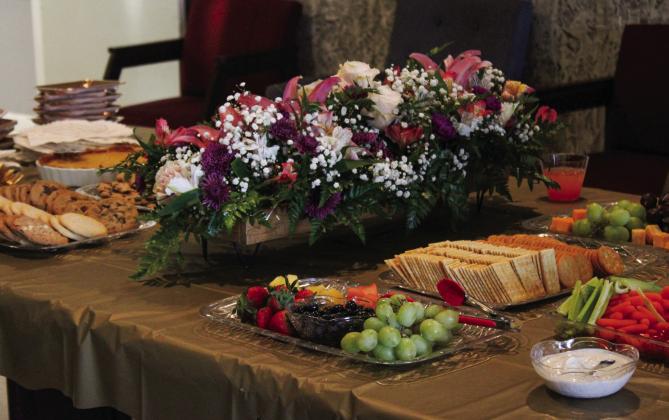 Refreshments, including punch, crackers, fruits, vegetables, desserts and more, were offered following a memorial bench dedication service for Ovilla Evans Thursday, Feb. 27 at the Memphis Housing Authority.