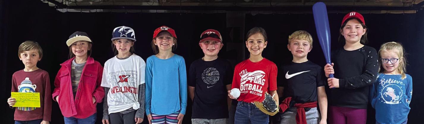 The Wellington Elementary School second-grade cast, performing in a Babe Ruth production, including Colt Dettle, left, Briley Holton, Peyton Roberson, Raylie Sims, Joe Lemons, Sophia Manuel, Quade Weatherly, Callahan Cantu and Dallas Duke, take the stage in the cafeteria. Response to Intervention (RTI) exercises, such as this, build confidence in students to increase success. Courtesy Photos