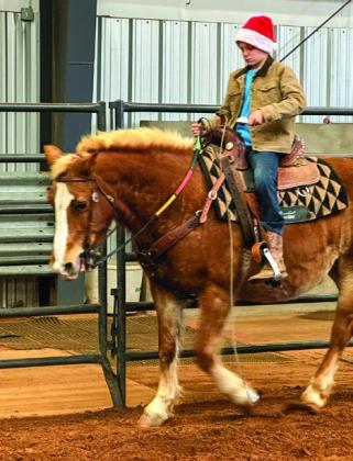 Childress County 4-H Horse Club members have a “hay” day at the recent Christmas Party, including horseback games and festive photo opportunities, Saturday, Dec. 14 at the Mashburn Event Center and Arena. Courtesy Photos