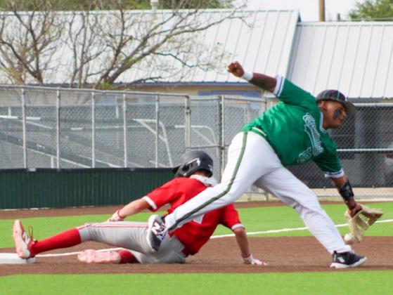 On the road again, Wellington sophomore Jax Heflin slides into third base as the Skyrockets are downed by the Floydada Whirlwinds, 13-8, Tuesday, April 14.