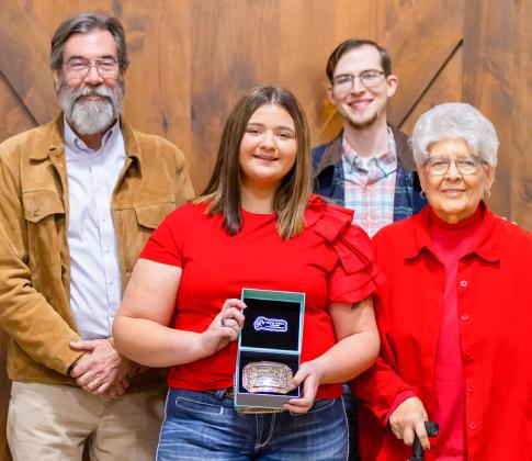 Wellington High School senior Jacy Lampe receives the Herdsmen Award in honor of the late Don Reeves during the Collingsworth County Livestock Association’s dinner and sale Saturday evening, Jan. 17 at the Bura Handley Community Center. From left: Wes Reeves, Jacy Lampe, John Reeves, Katherine Reeves. Uplift Imaging