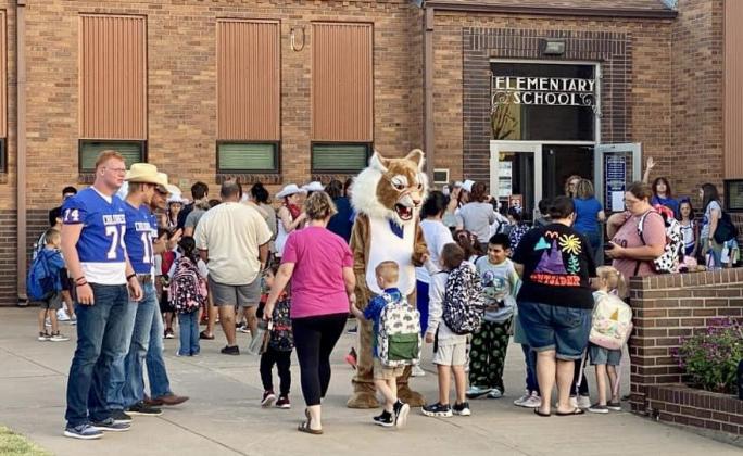 Childress Elementary School students visit with the Childress Bobcats prior to the start of school Friday, Aug. 25.