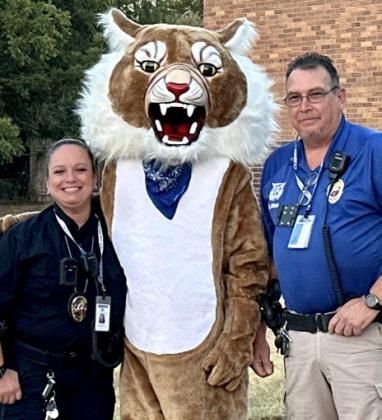Through the Lens of Liz/Elizabeth Oronia Childress Independent School District (ISD) School Resource Officers Lisa Marie Gonzalez and Sgt. Jerald Johnson greet Childress Elementary School students Friday morning, Aug. 25.