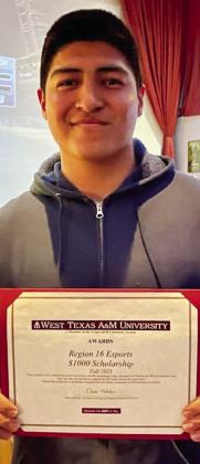 Wellington High School senior Gael Rodriguez accepts a $1,000 West Texas A&amp;amp;M University scholarship during the eSports Invitational. Courtesy Photos