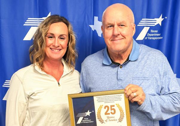 Childress District of the Texas Department of Transportation Engineer Darwin Lankford presents a 25-year service award to Mandy Cabler, Childress District Lab. Additional 25-year recipients included Chad Skelton, Childress Area Office, and Lonnie Guerrero, Cottle County maintenance.