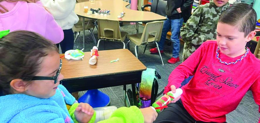 Childress Elementary School students celebrate Christmas around the world, learning about different countries’ holiday traditions and even getting to open Christmas crackers from England. Photos Courtesy of Childress Elementary School